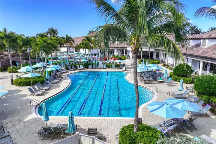 Community pool with a patio