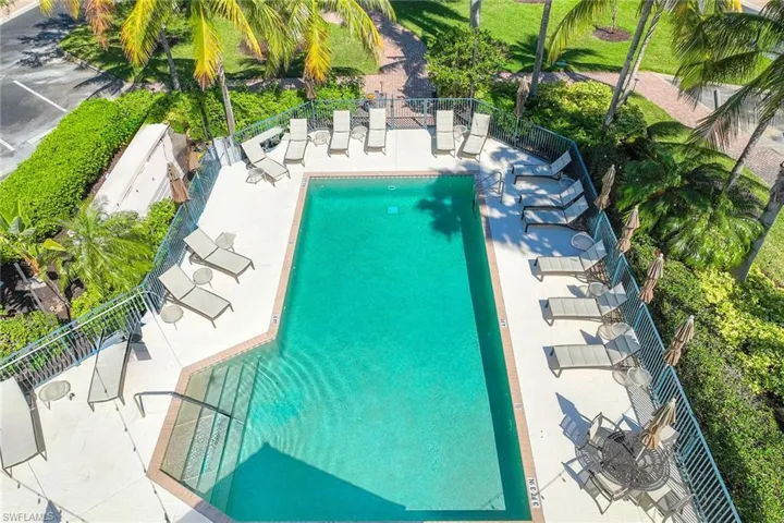 Community pool with a patio area