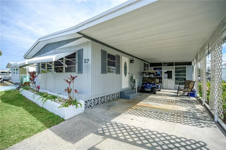 View of front of home with a carport