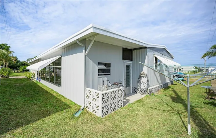 View of home's exterior featuring a lawn