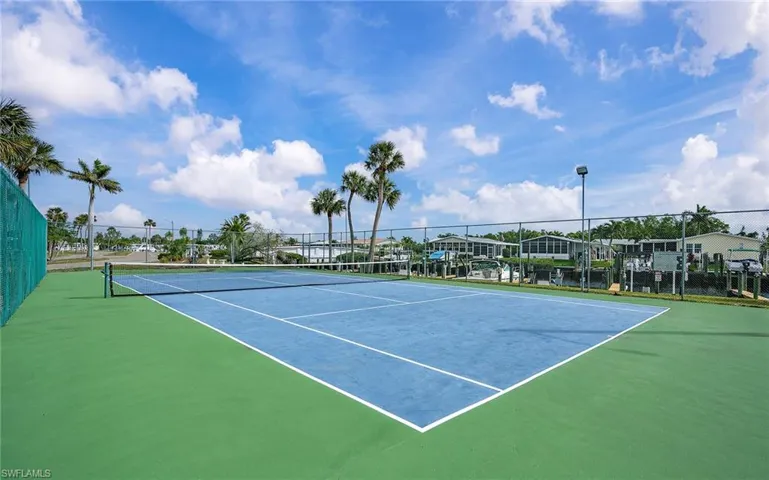 View of tennis court with basketball court