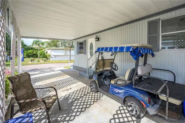 View of patio with a carport