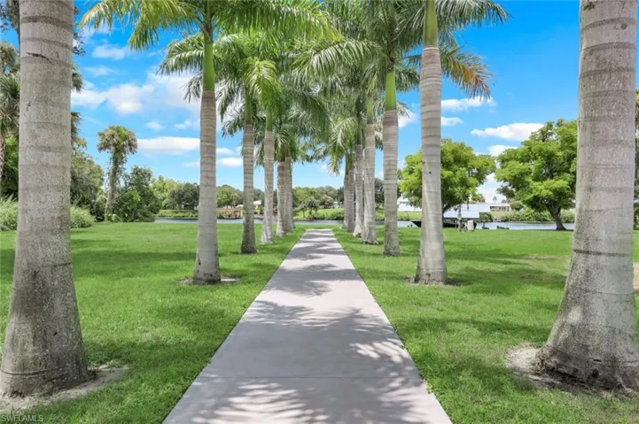 View of property's community featuring a yard