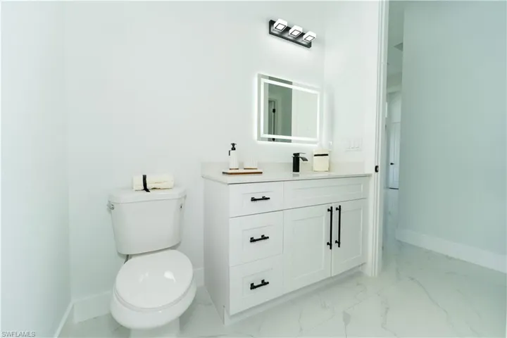 Bathroom with vanity and toilet