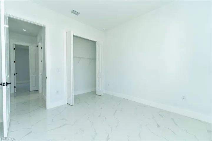 Unfurnished bedroom with a closet