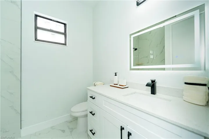 Bathroom with toilet and vanity