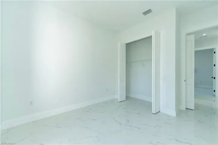 Unfurnished bedroom with a closet
