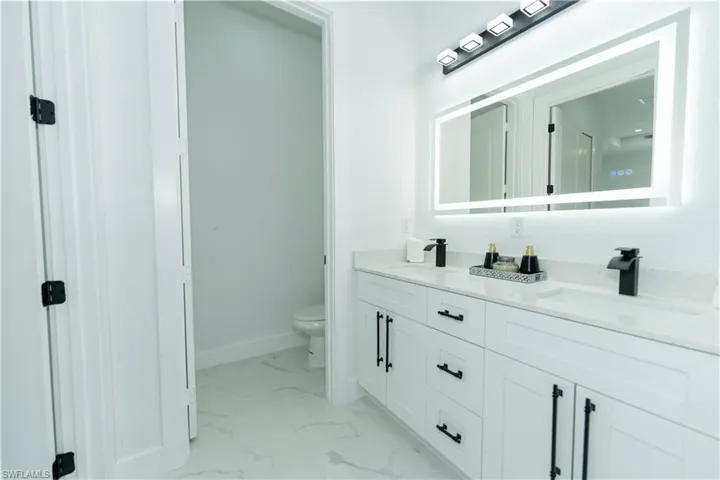 Bathroom with vanity and toilet