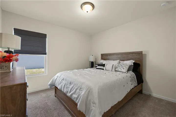 Bedroom with carpet flooring