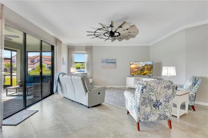Sunshade blocking pull down curtain on triple slider. Nice furniture arrangement, stays with property!