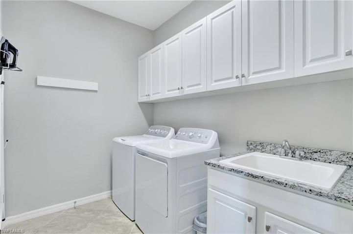 Utility sink, wall mounted compact pull out clothes line