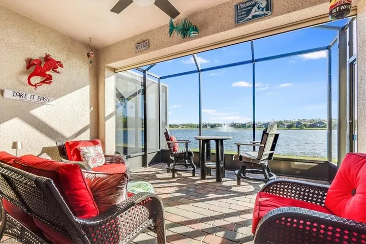 Covered lanai with extended screened in patio. Features outdoor fan and electric storm shutters