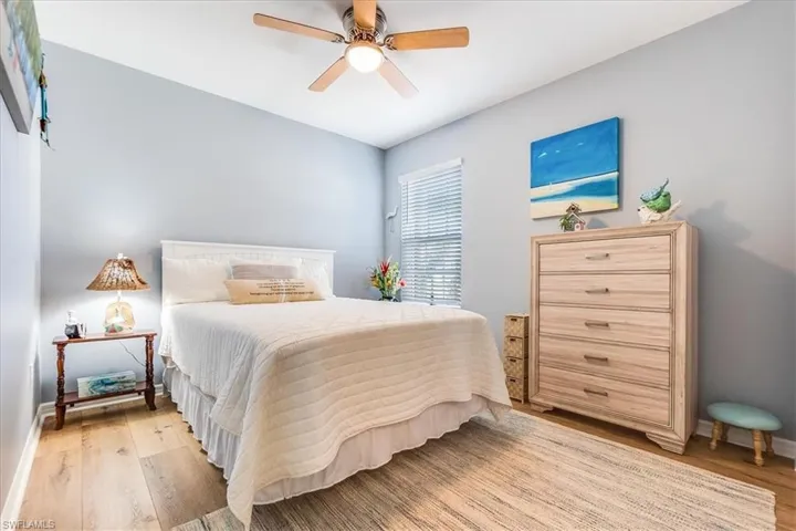 2nd bedroom with light laminate flooring. Large closet and fan