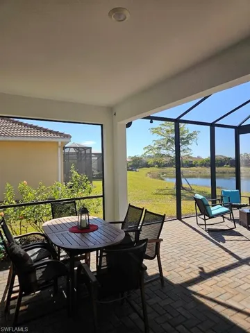 Sunroom with a water view
