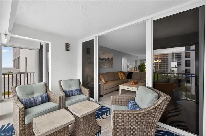 Lanai with comfortable seating area. - Virtually Edited Image