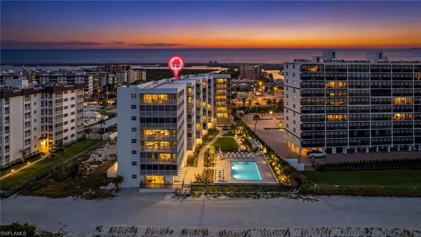 City view at dusk with view of Ostego Bay in background.