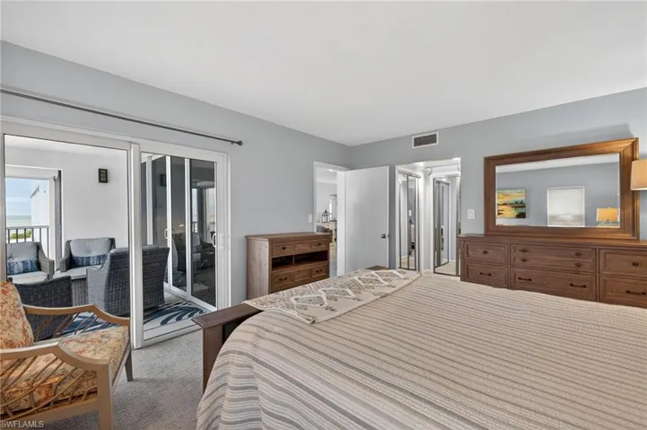 Carpeted bedroom with access to outside - Virtually Edited Image