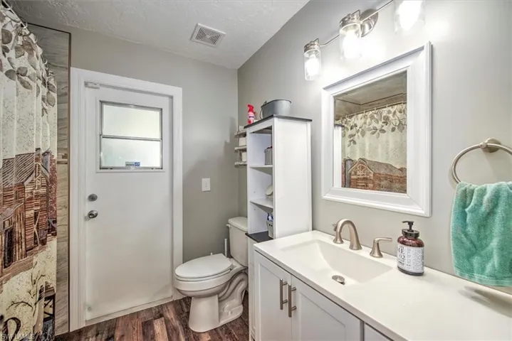 Guest bathroom that leads to the lanai which is perfect for entertaining or if you add a pool.