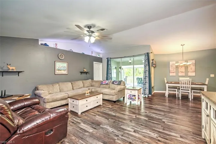 Family room view from the entry with a triple slider to view the lanai.