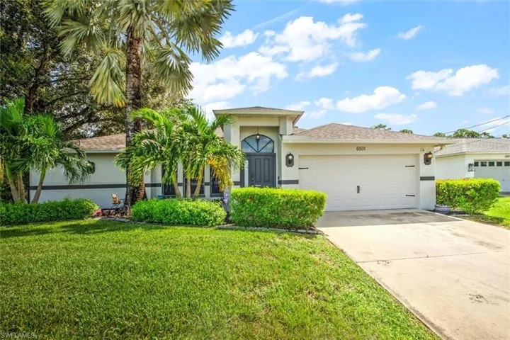 Nice mature landscaping makes this home have excellent curb appeal. Fresh paint and a new garage door that is impact and insulated.