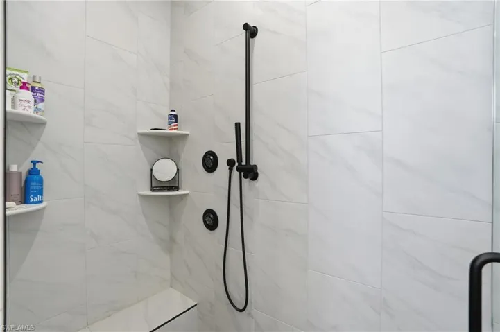 Bathroom featuring a tile shower