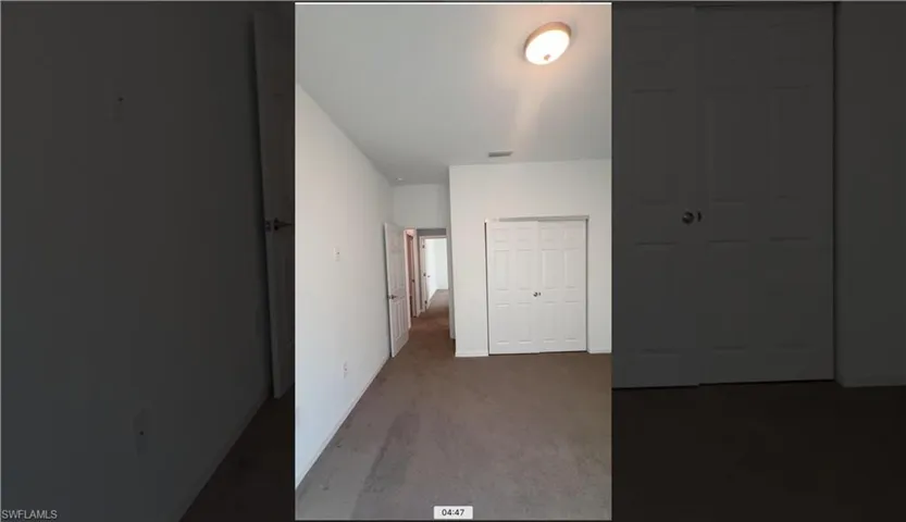Unfurnished bedroom featuring carpet floors and a closet