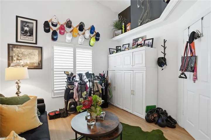 Game room with light wood-style flooring