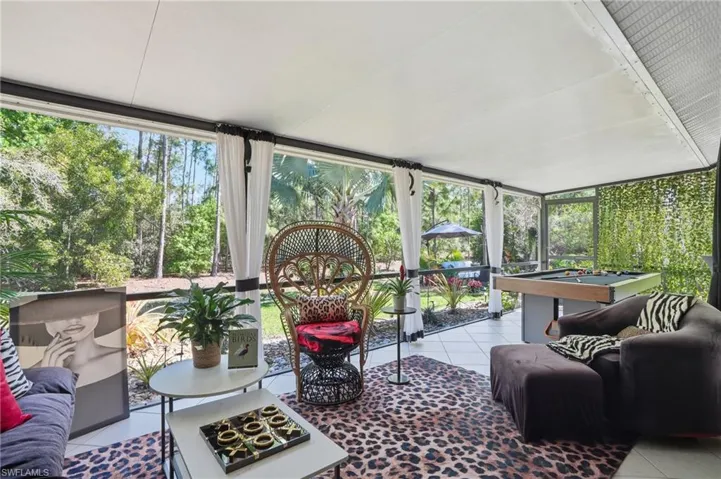 Sunroom / solarium featuring an outdoor hangout area and plenty of natural light