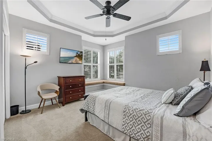 2nd bedroom offers a lovely seating area to curl up and read a good book! Tray ceiling!
