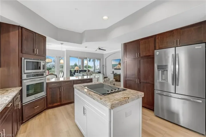 While preparing your favorite meals, enjoy sweeping views of the golf course and lakes beyond. The remodeled kitchen opens seamlessly to the living areas, creating the perfect space for effortless entertaining.