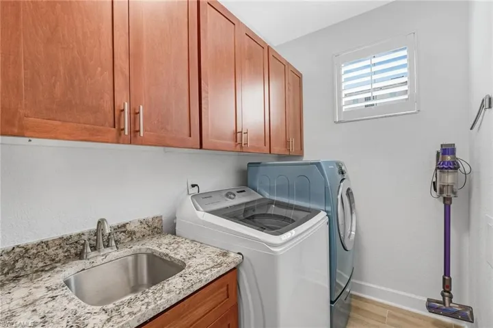 Enjoy a bright laundry room complete with a sink and generous storage.