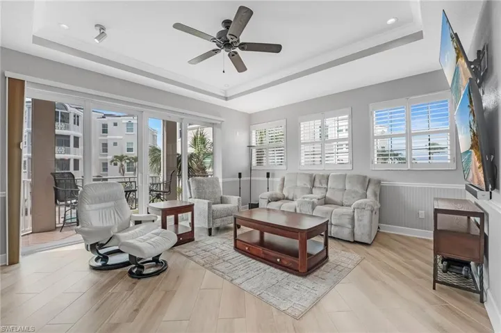 This spacious second living area opens to your back lanai, offering stunning views of the marina.