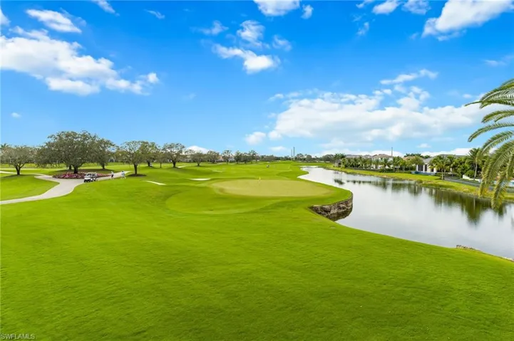 View of home's community featuring a water view and view of golf course