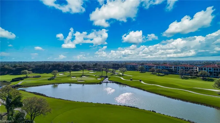 Drone / aerial view of a local golf course and a nearby body of water