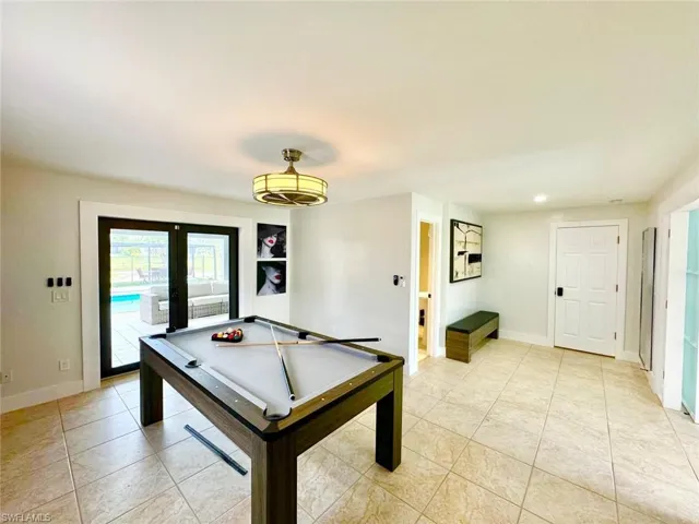 Playroom with pool table, recessed lighting, french doors, and light tile patterned floors