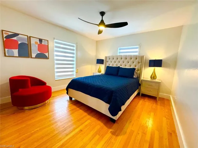 Bedroom featuring wood finished floors and ceiling fan