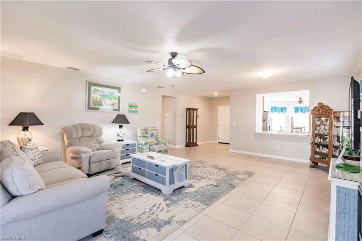 Tiled living room with ceiling fan