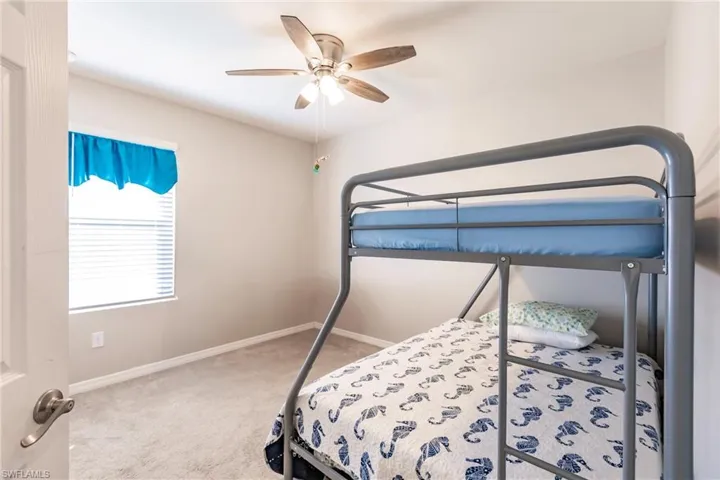 Bedroom with carpet flooring and ceiling fan