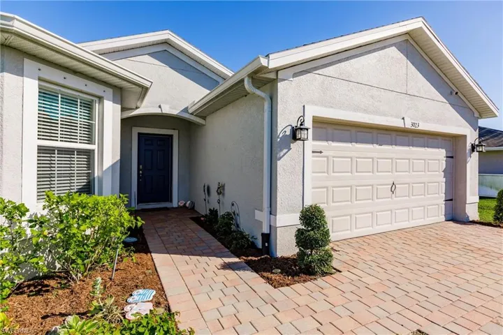 Property entrance with a garage
