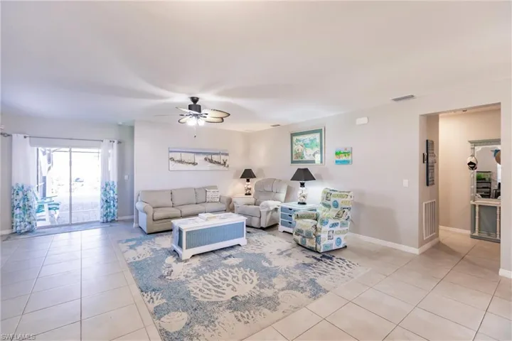 Tiled living room with ceiling fan