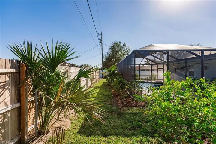 View of yard with a lanai