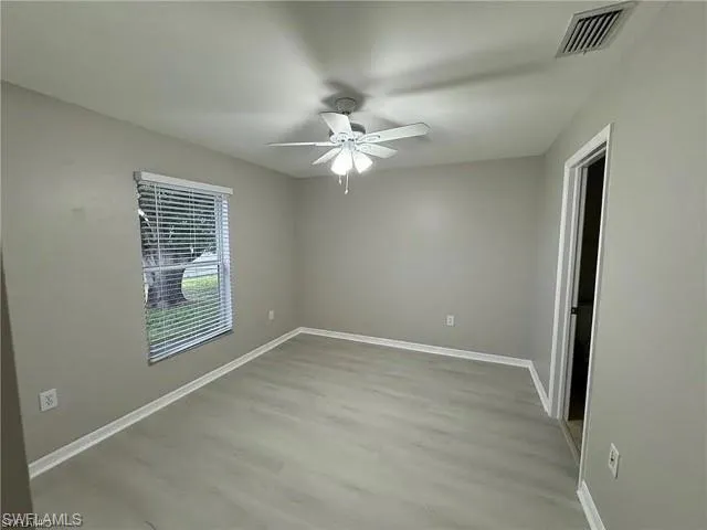Spare room featuring ceiling fan and wood finished floors