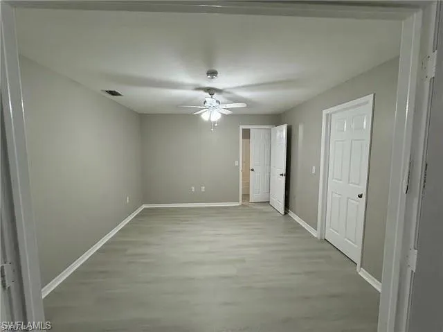 Unfurnished bedroom with light wood-type flooring and a ceiling fan