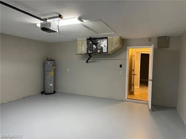 Garage with water heater and a garage door opener