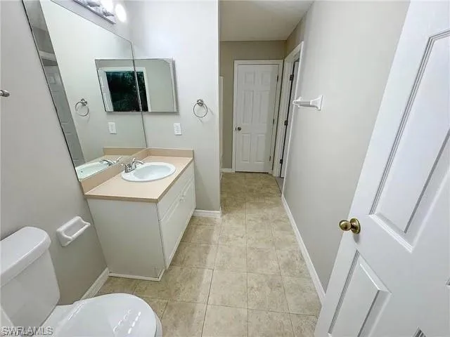 Bathroom featuring vanity and tile patterned flooring