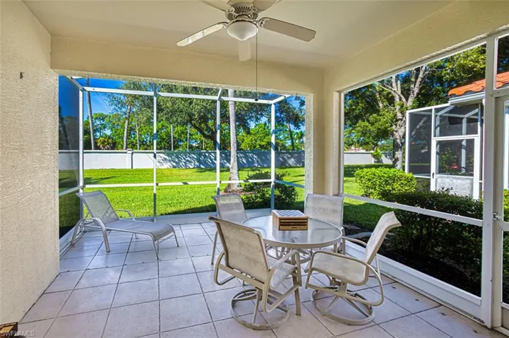 Sunroom / solarium featuring ceiling fan and outdoor dining area