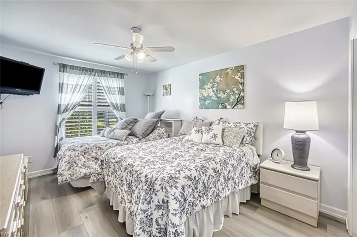Bedroom featuring ceiling fan and wood finished floors