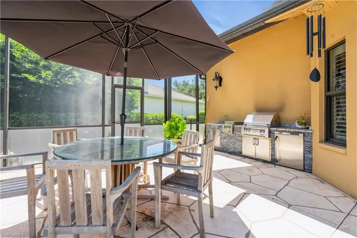 View of patio / terrace featuring grilling area and an outdoor kitchen