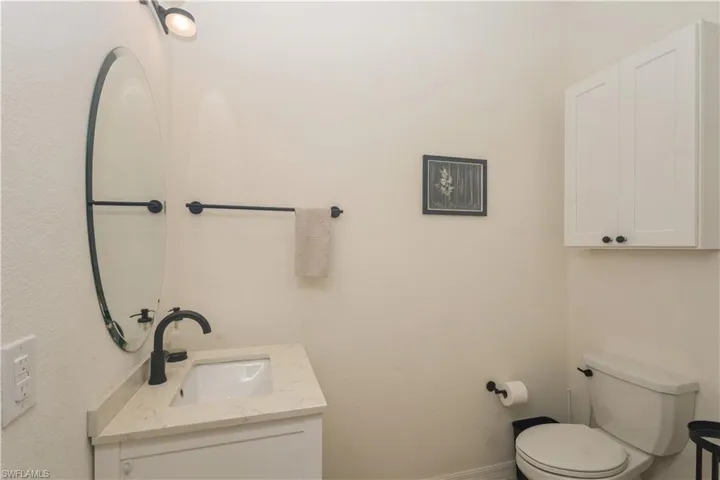 Bathroom with oversized vanity and toilet