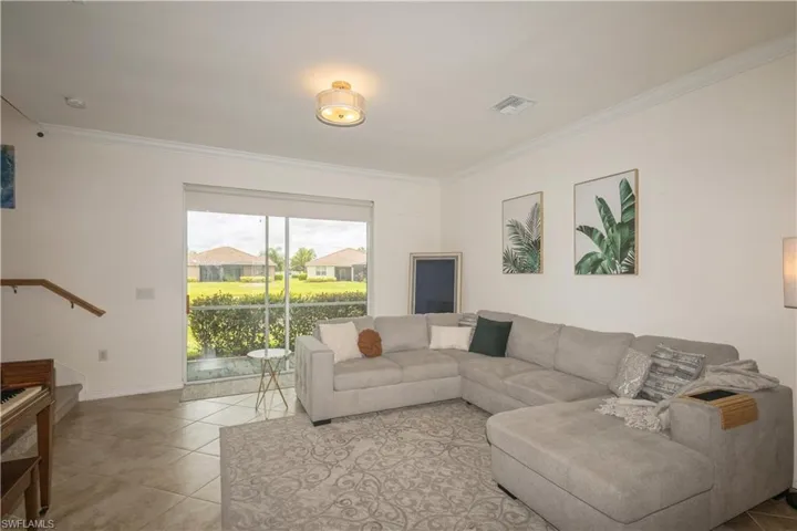 Tiled living room with ornamental molding
